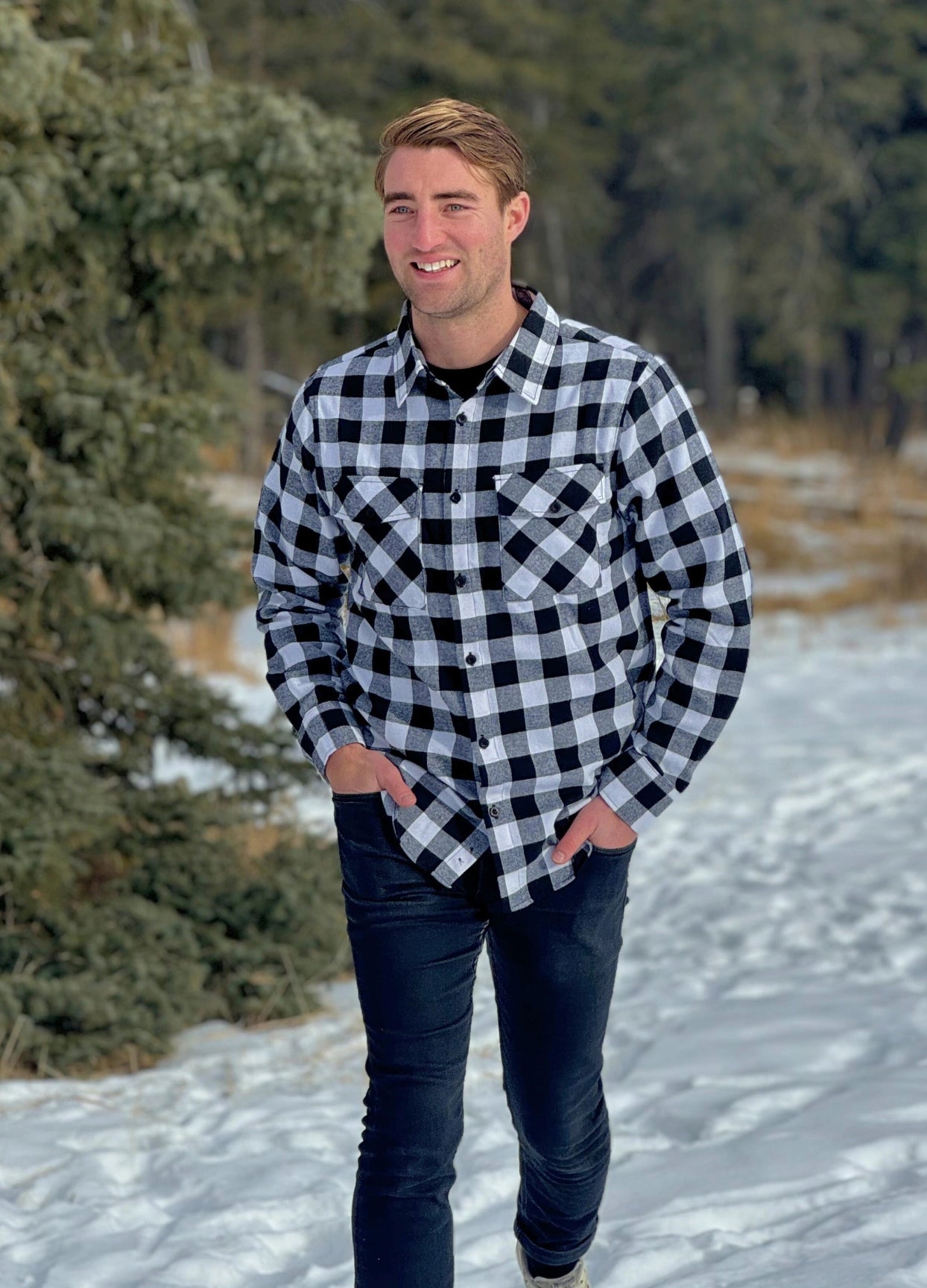Classic Black and White Buffalo Check Shirt taken outside in the snow in Banff, Canada. The shirt has 2 front pockets and is fitted.