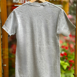 Grey t-shirt on a hanger with a blurred background
