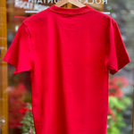 Red t-shirt on a hanger with a blurred background
