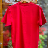Red t-shirt on a hanger with a blurred background
