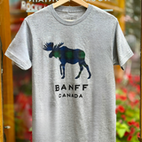 Grey t-shirt with moose graphic and 'Banff Canada' text on a hanger.