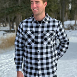 Classic Black and White Buffalo Check Shirt taken outside in the snow in Banff, Canada. The shirt has 2 front pockets and is fitted.