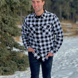 Classic Black and White Buffalo Check Shirt taken outside in the snow in Banff, Canada. The shirt has 2 front pockets and is fitted.