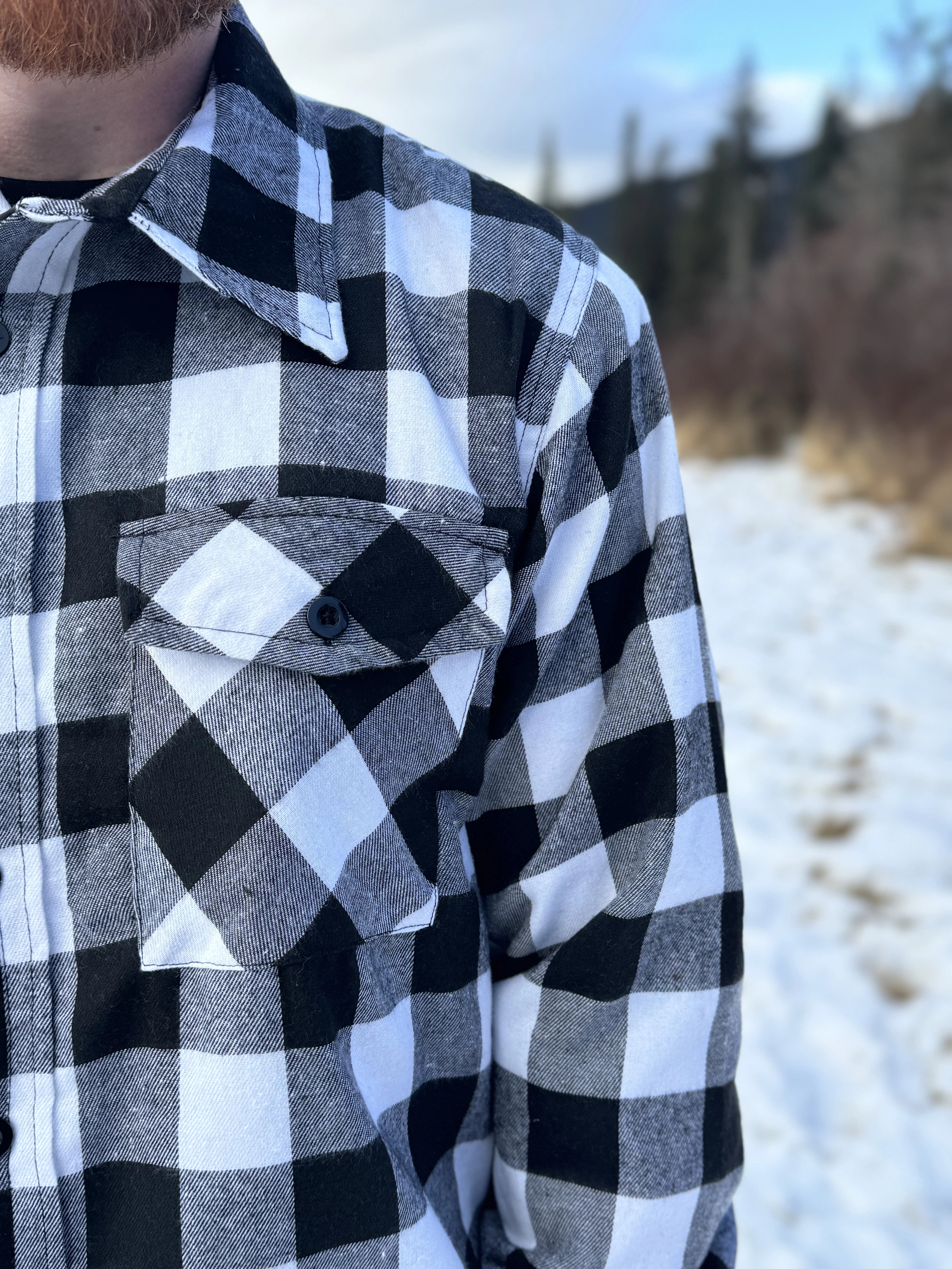 The outer layer is flannel, and the inside is a lightweight fibre quilted layer. Wear it on its own or as a layering piece!