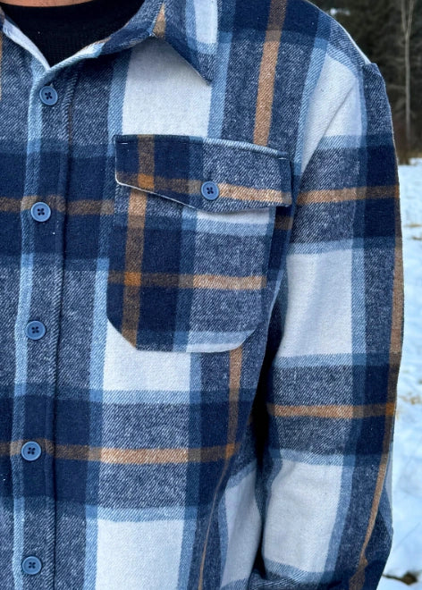 Close up of pocket in Blue & Caramel Plaid Jacket. 75% polyester, 25% cotton. 2 breast pocket.