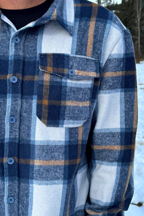 Close up of pocket in Blue & Caramel Plaid Jacket. 75% polyester, 25% cotton. 2 breast pocket.