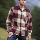 A person wearing a long-sleeved burgundy and beige plaid flannel shacket with a single breast pocket, button cuff, and V-silhouette.