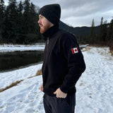 Black quarter zip polo with canada flag logo on left arm.