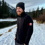 Black quarter zip polo with canada flag logo on left arm.