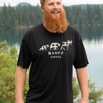 Man wearing a black 'Banff Canada' t-shirt with a scenic background