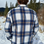 Back view of the Brush Flannel Shacket in Blue & Caramel Plaid. 75% polyester, 25% cotton. 2 breast pocket.