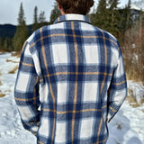 Back view of the Brush Flannel Shacket in Blue & Caramel Plaid. 75% polyester, 25% cotton. 2 breast pocket.