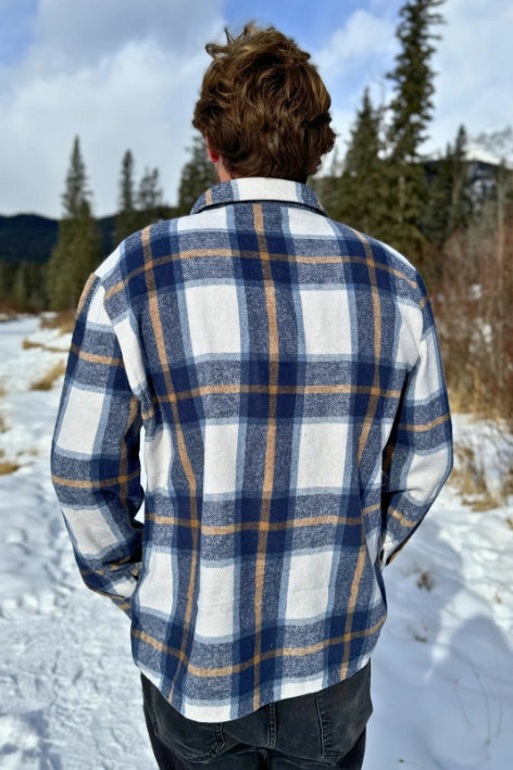 Back view of the Brush Flannel Shacket in Blue & Caramel Plaid. 75% polyester, 25% cotton. 2 breast pocket.