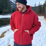 Full Zip red Hoodie with white canada maple leaf logo on left arm.