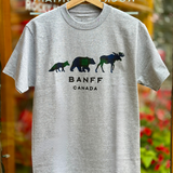 Grey t-shirt with bear and moose design and 'Banff Canada' text on a hanger.