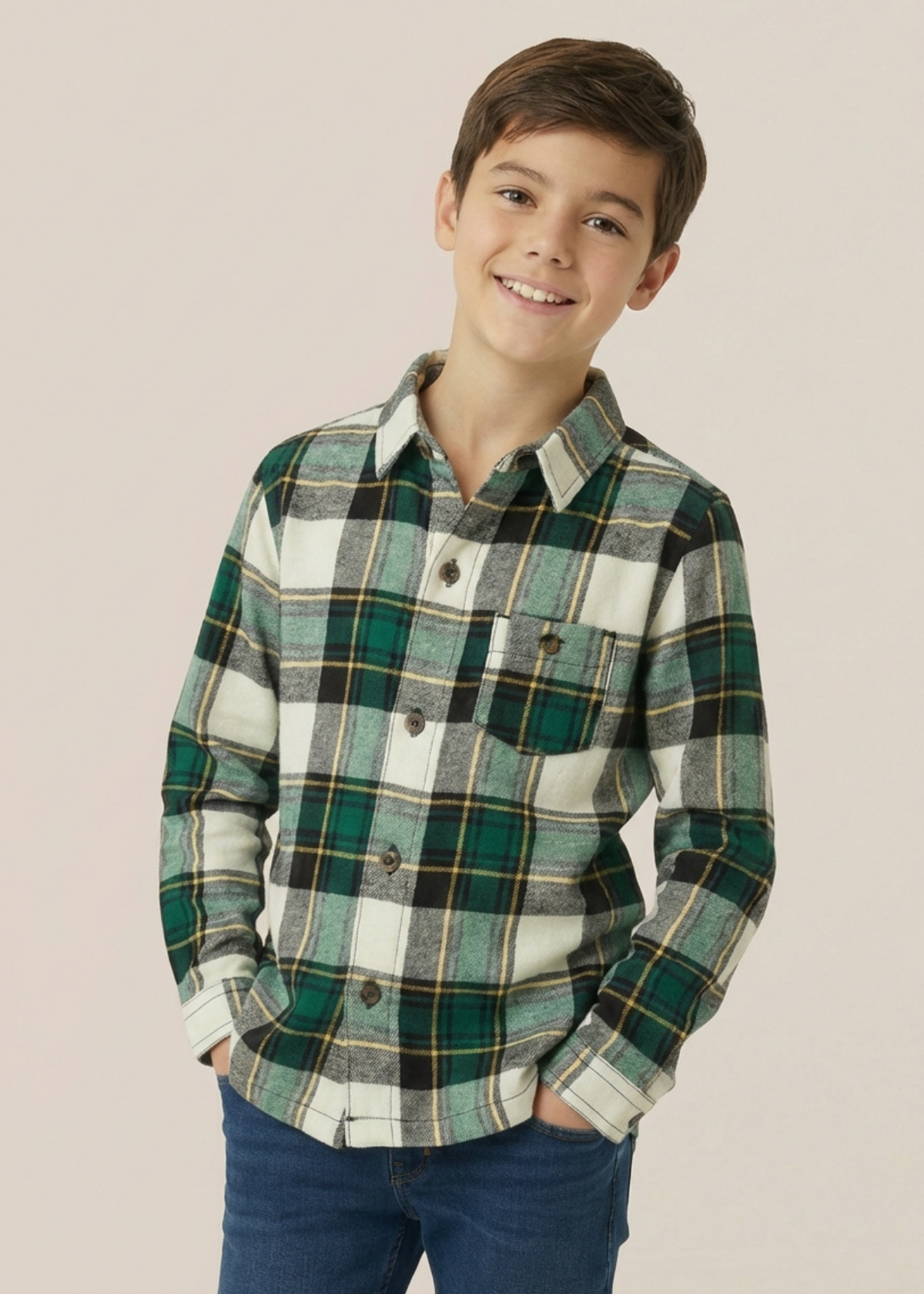 Child wearing a green plaid shirt against a beige background