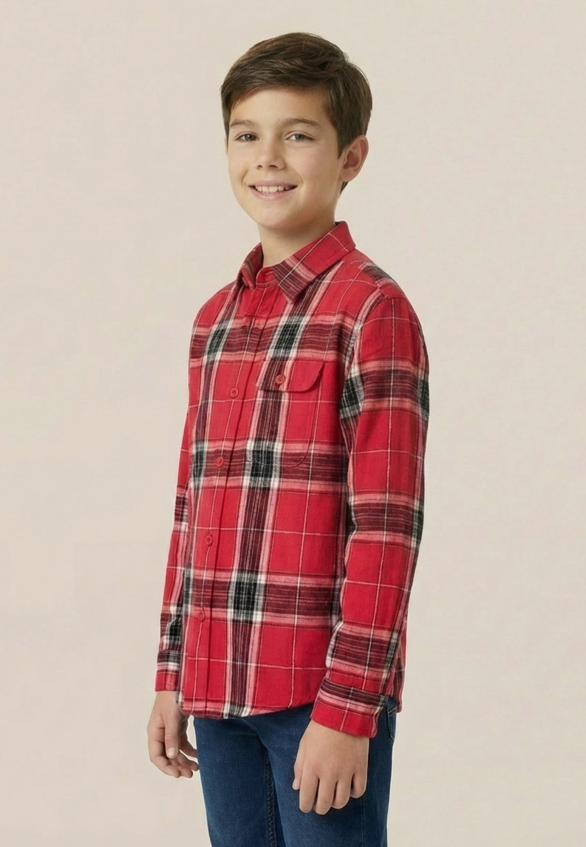 Child wearing a red plaid shirt on a beige background