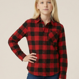 Youth girl wearing a unisex red and black buffalo check shirt with a plain background