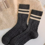 Pair of dark gray wool socks with cream stripes 