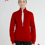 A woman wearing a full zip fitted Canadian jacket in red with a Canadian flag patch on the left sleeve and a flat-lock stitching detail.
