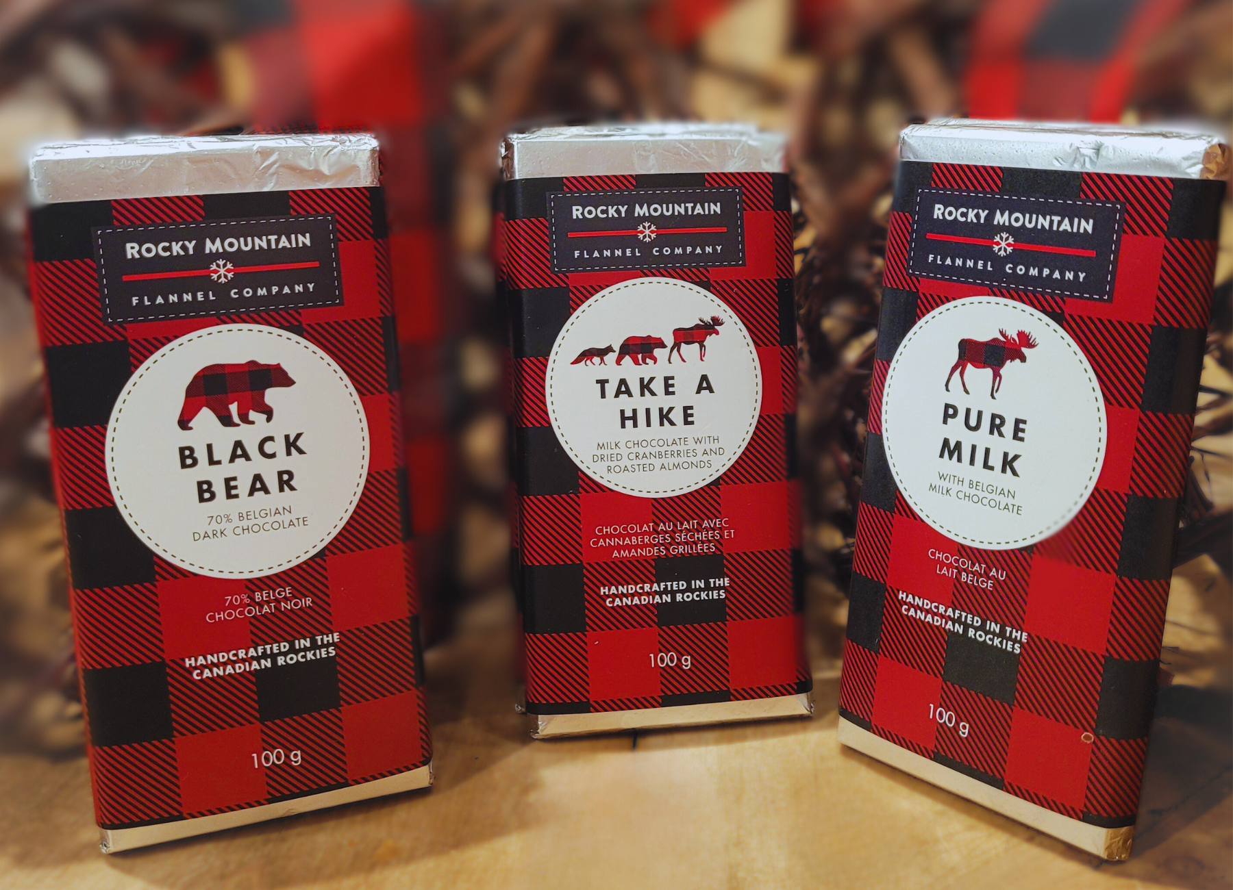 Three packages of Rocky Mountain Flannel Company products on a wooden surface.