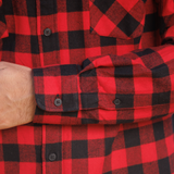 Close-up of a red and black checkered shirt with a focus on the pattern and fabric texture.