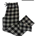 Black and gray checkered pajama pants on a white background with 'RESTOCKED' label.