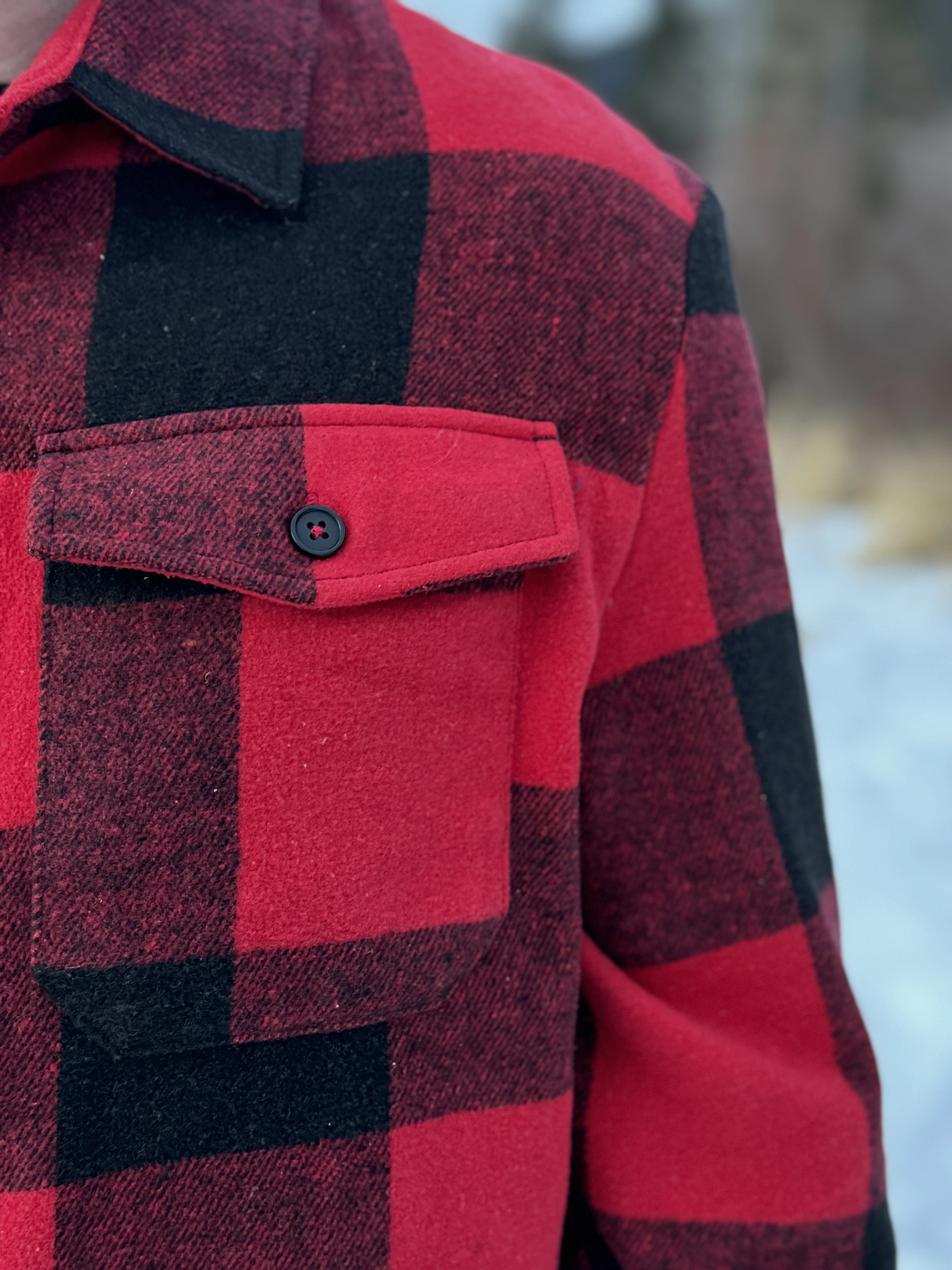 Canadian classic red jacket, close up of the pocket.