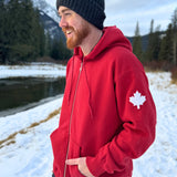 Full Zip red Hoodie with white canada maple leaf logo on left arm.
