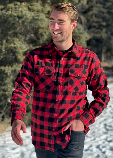 Michael is wearing our Red and Black Buffalo Check Flannel Shirt. This is a men's fit - the shoulder is cut wider, the hip is cut narrower and the sleeves will always be longer! 60% Cotton / 40% Polyester, brushed slightly on both sides for that "Flannel" feel. Two flap breast pockets and two button cuff. 