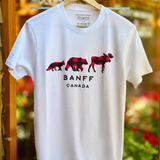 White t-shirt with red plaid bear design and 'Banff Canada' text on a hanger.