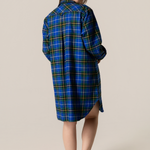 Person wearing anova scotia tartan nightshirt against a beige background