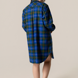 Person wearing anova scotia tartan nightshirt against a beige background