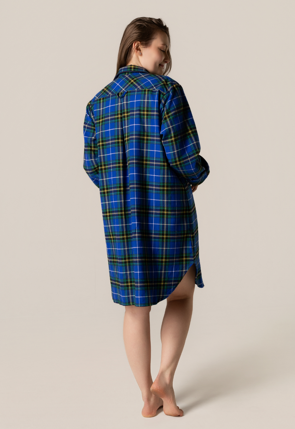 Person wearing anova scotia tartan nightshirt against a beige background