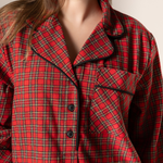Red plaid nightgown worn by a person with a neutral background