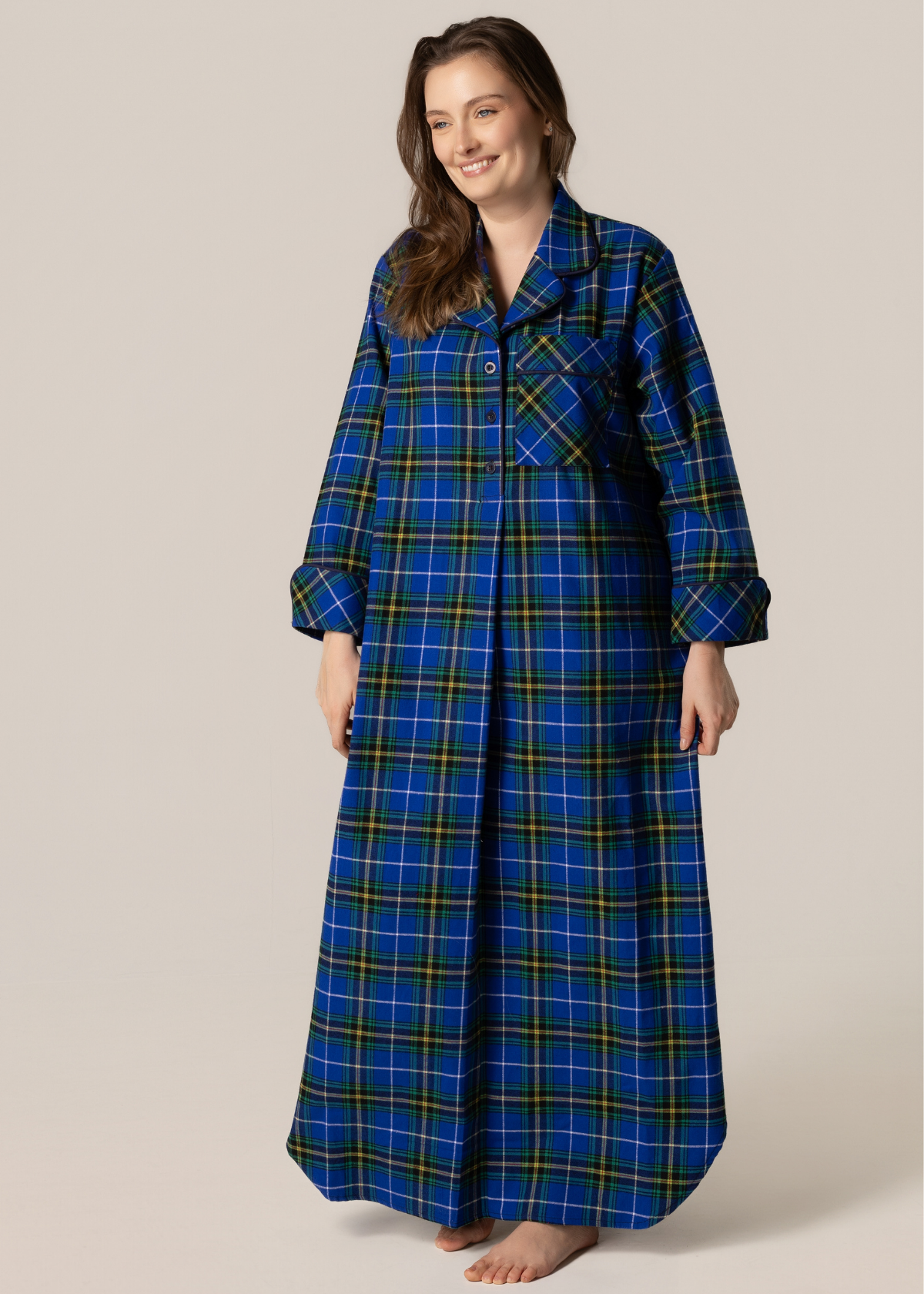 Woman wearing a blue plaid nightshirt on a beige background