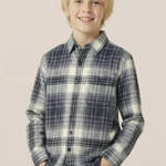 Young boy wearing a plaid shirt against a plain background