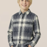 Young boy wearing a plaid shirt against a plain background