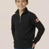 Child wearing a black polo with a Canadian flag on a beige background