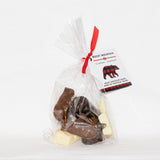 Packaged chocolate treats shaped like bears in a clear bag with a red ribbon, labeled as Rocky Mountain Chocolates.