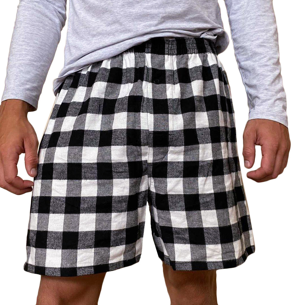Men's boxer shorts with a black and white checkered pattern, featuring a single button fly front and an elastic waistband.