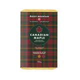 Packaging of Rocky Mountain Flannel Company's Canadian Maple with Belgian White Chocolate bar. The packaging has a plaid pattern with red, green, and black colors and a maple leaf logo.